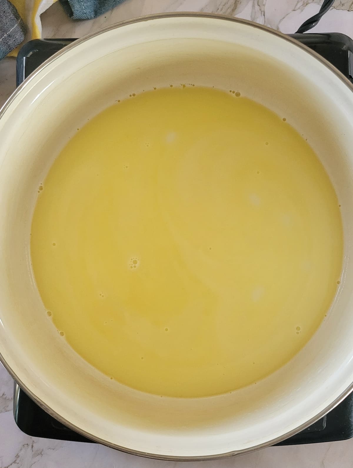 condensed milk in a pot on a burner