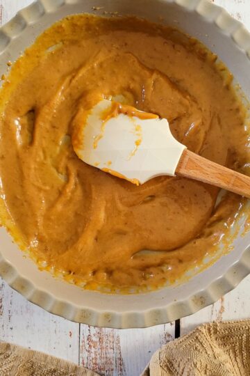 caramel sauce and a rubber spatula in a dish