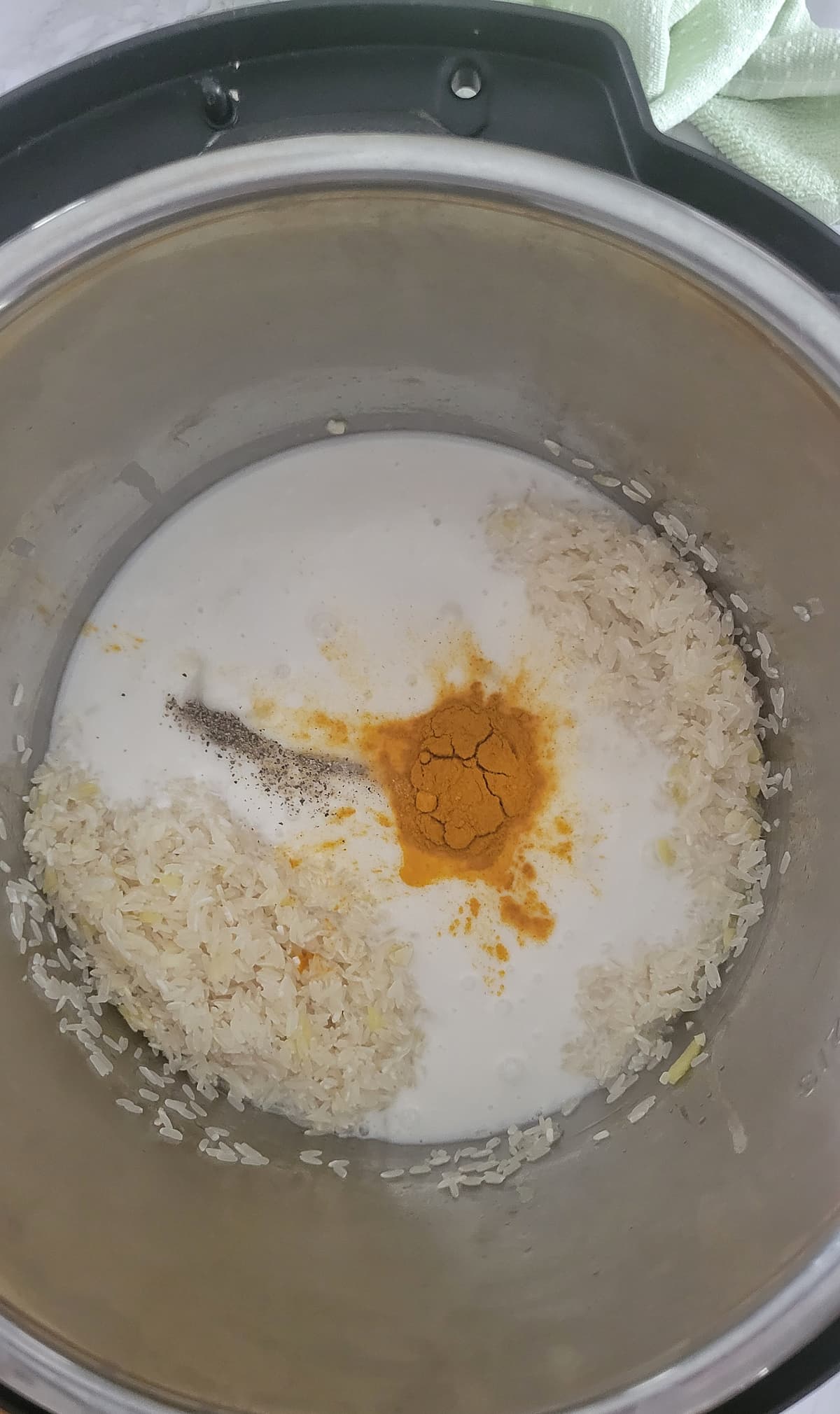 milk, spices and rice in the instant pot