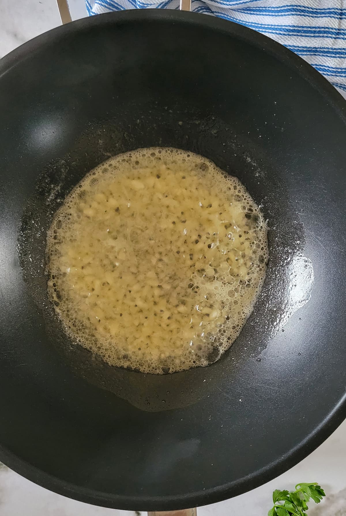 minced garlic in butter in a skillet