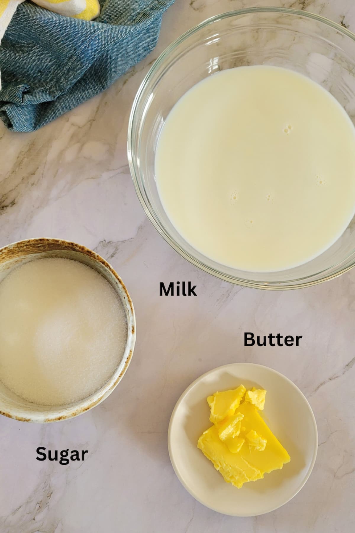 ingredients for recipe for condensed milk - milk, butter, sugar
