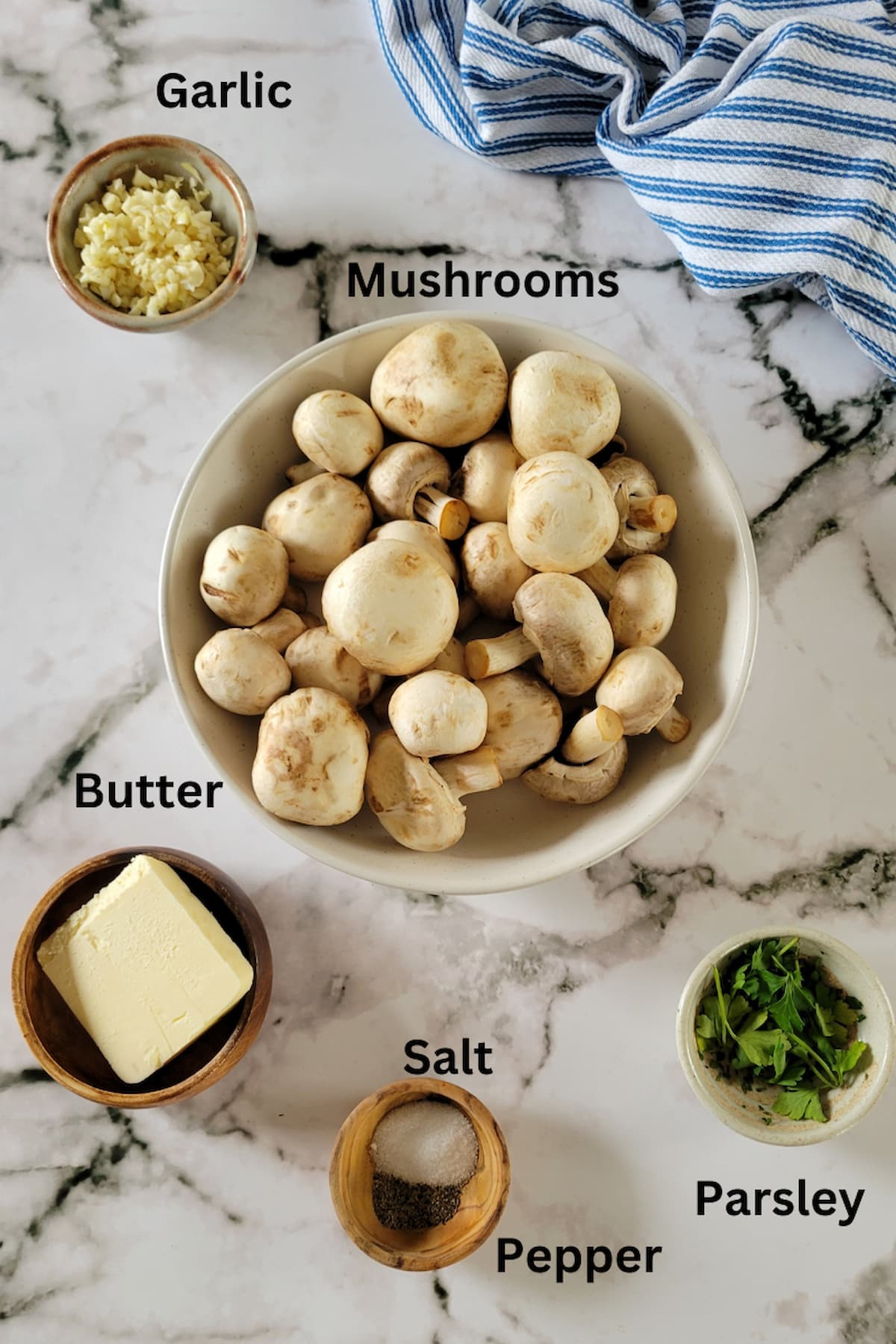 ingredients for mushrooms with garlic butter - garlic, butter, mushrooms, parsley, salt, pepper