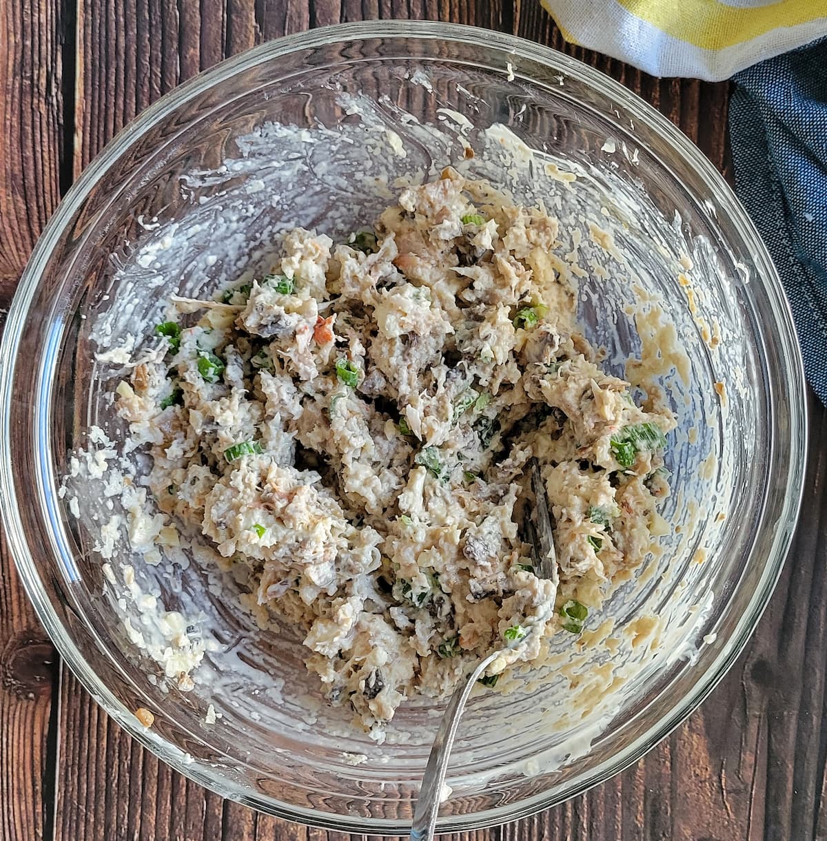 creamy crab meat filling in a bowl with a fork