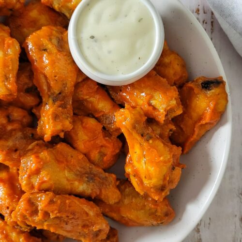 bowl of hot chicken wings with ranch sauce