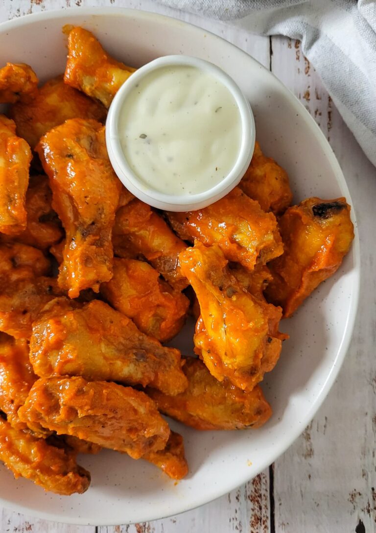 bowl of hot chicken wings with ranch sauce