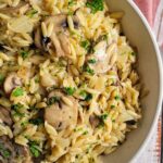 orzo with mushrooms and fresh chopped parsley in a bowl