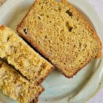 slices of banana bread on a plate (one cut in half), more in the background