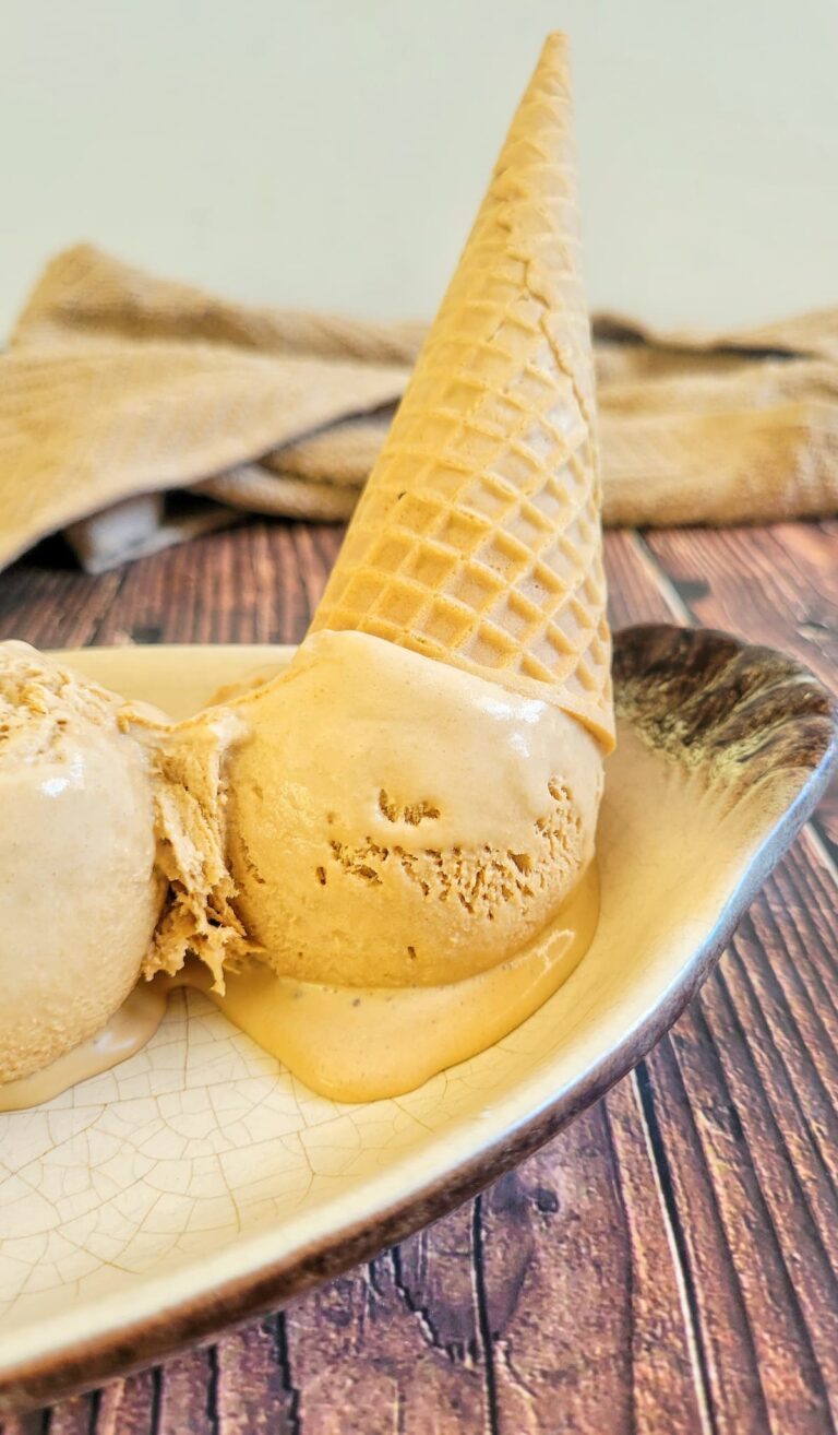 upside down ice cream cone in a dish with melting coffee ice cream