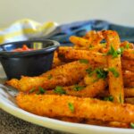 plate of keto fries with fresh chopped parsley