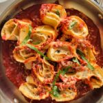 rosette al forno (pasta roses) in tomato sauce with fresh basil