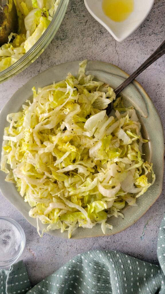 plate of shredded lettuce with a fork