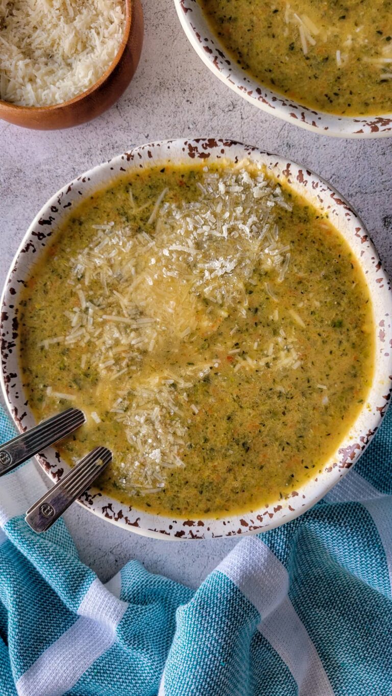 bowl of broccolini soup with two spoons