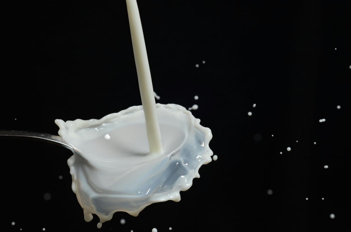 cream pouring into a spoon