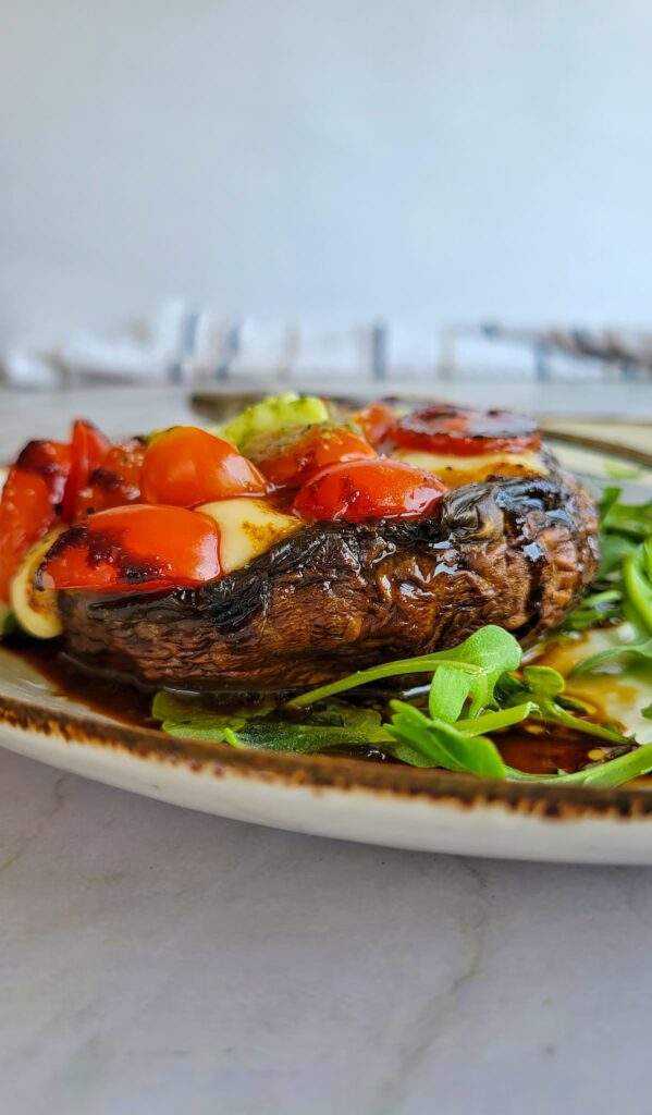 CAPRESE STUFFED MUSHROOMS WITH PESTO BUTTER