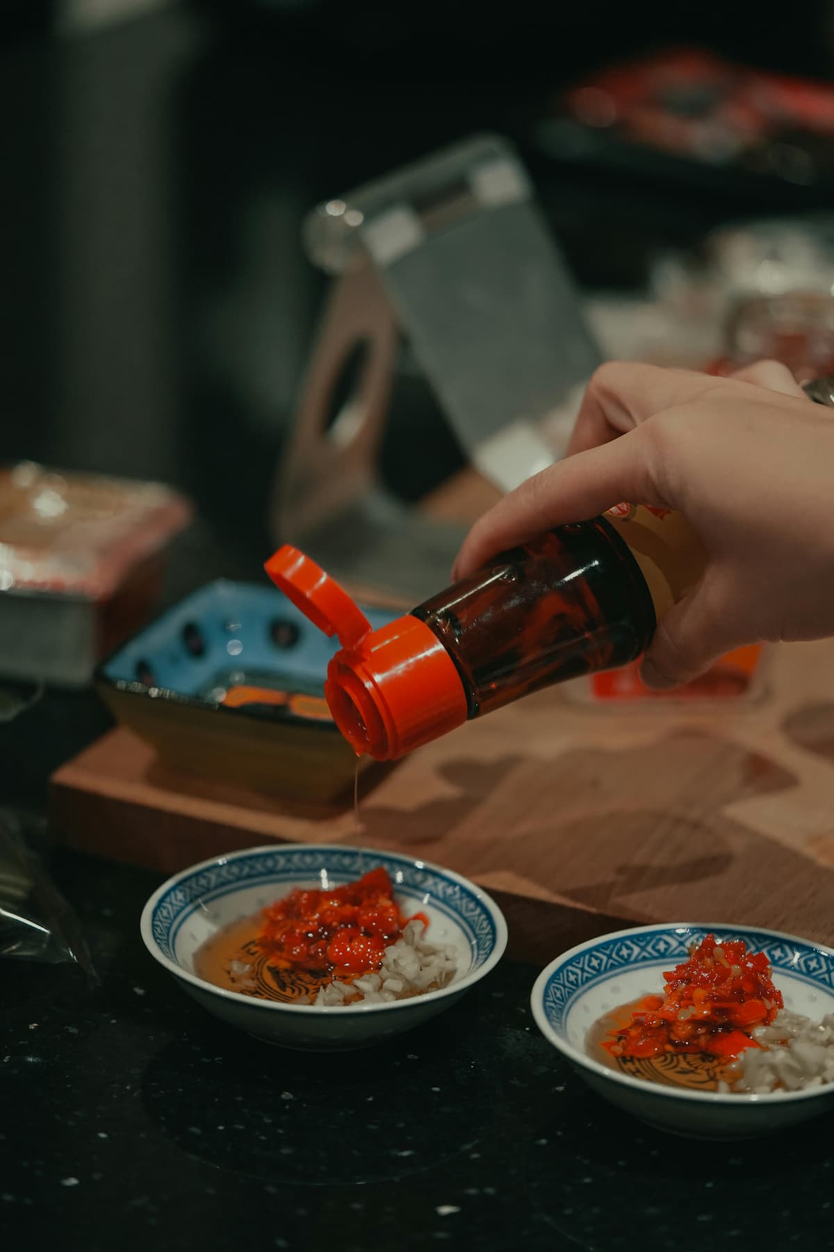 sesame oil pouring into dishes of food