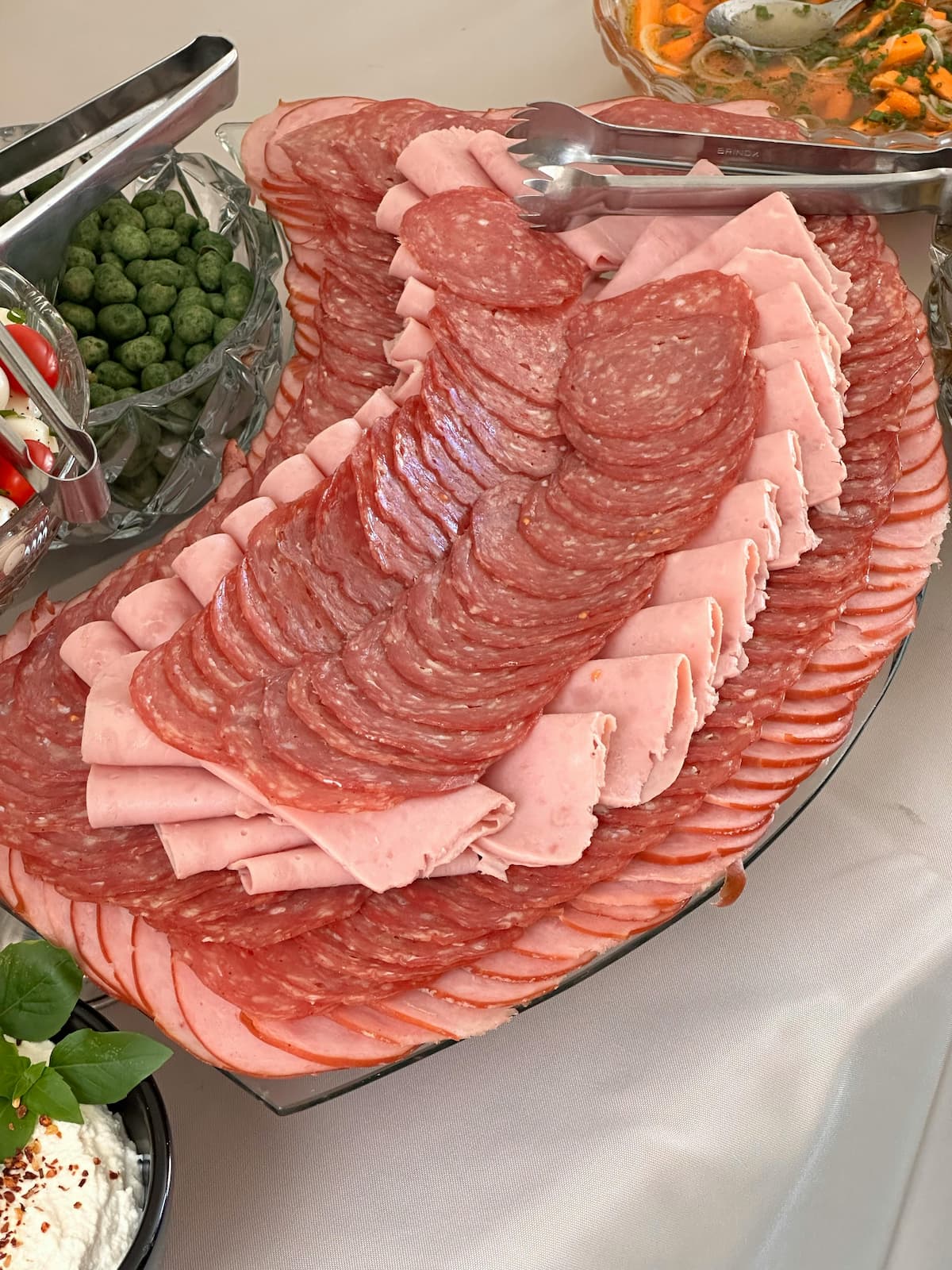 sliced salami and deli meat on a tray