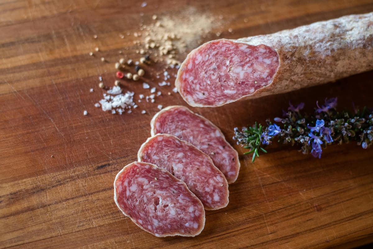 sliced salami on a cutting board