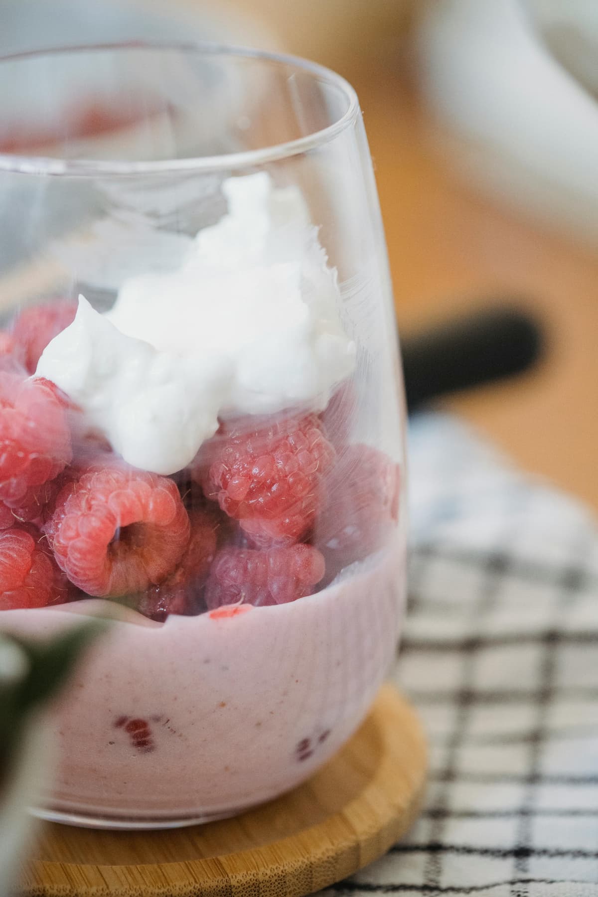 raspberry yogurt parfait with fresh raspberries and cream