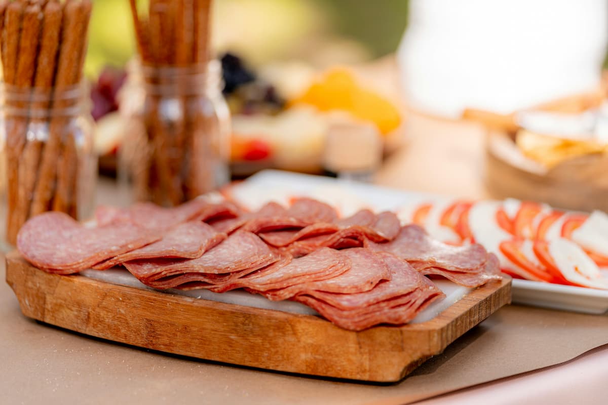 slices of pepperoni on a cutting board
