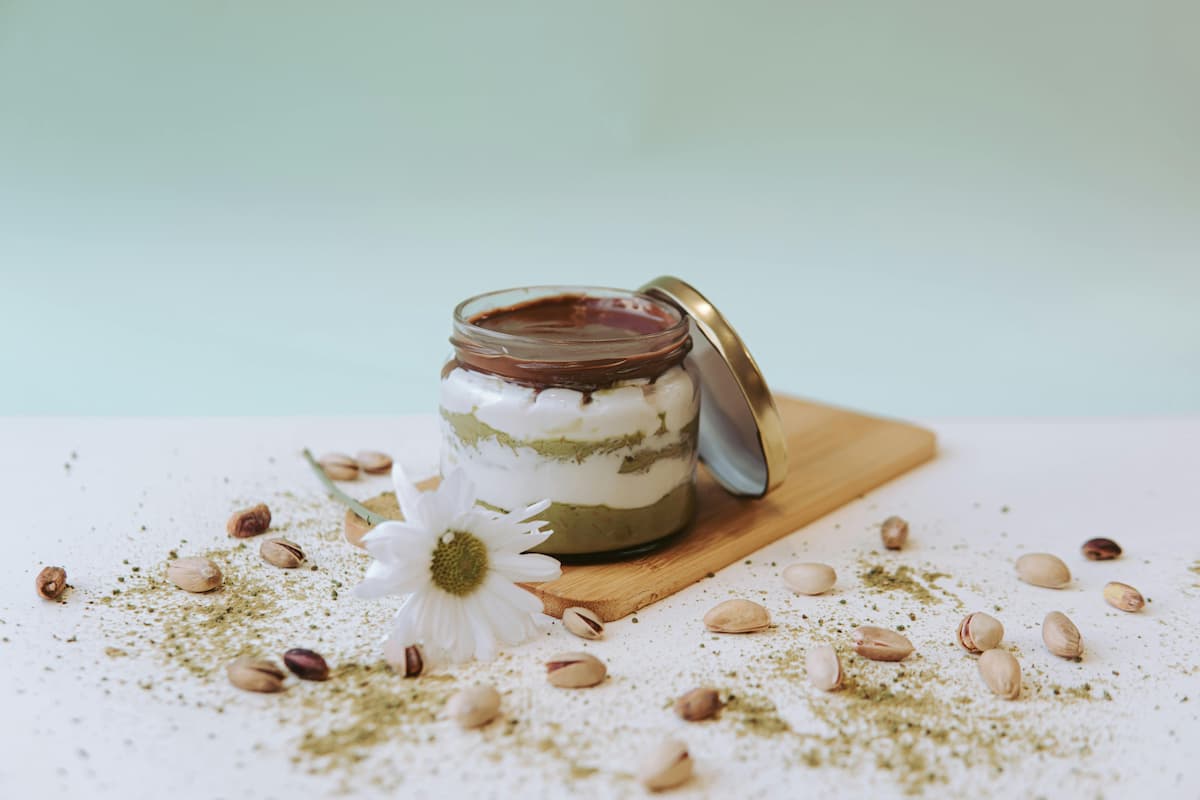 layered matcha yogurt parfait with pistachios and chocolate