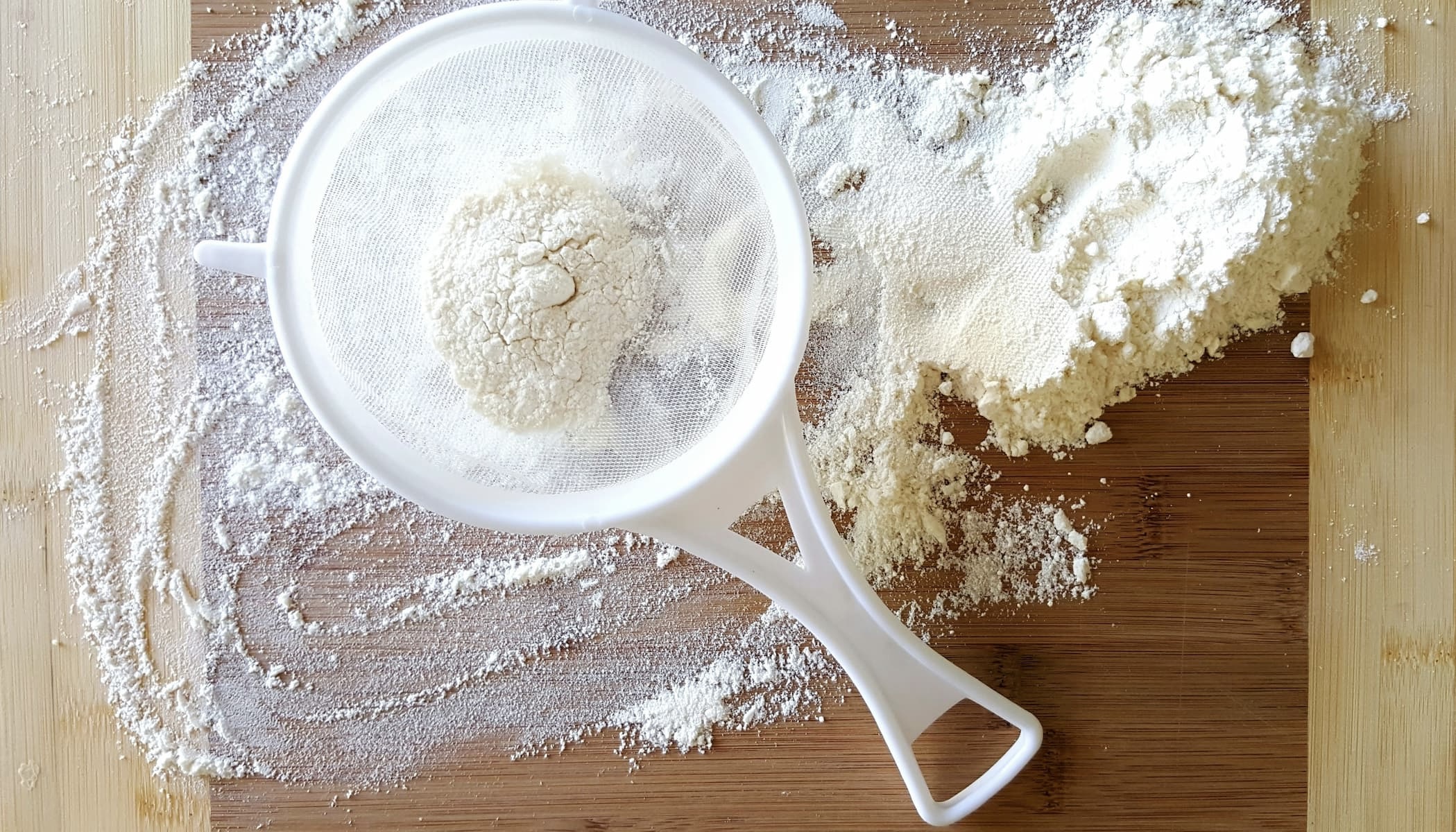tapioca starch on a cutting board in a measuring cup