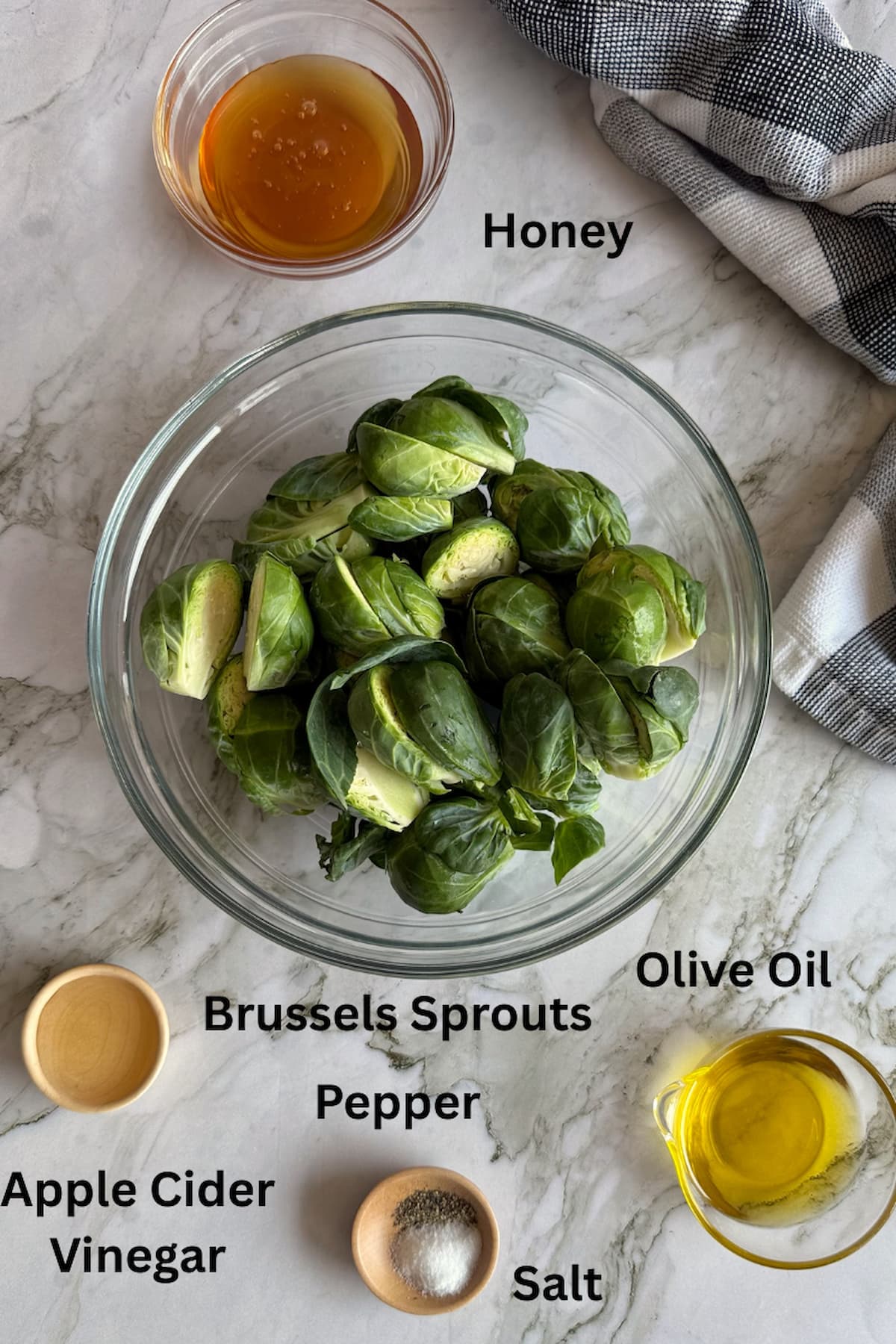 ingredients for honey roasted brussel sprouts - brussels sprouts, honey, apple cider vinegar, olive oil, salt, pepper