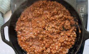 tomato meat sauce in a cast iron skillet