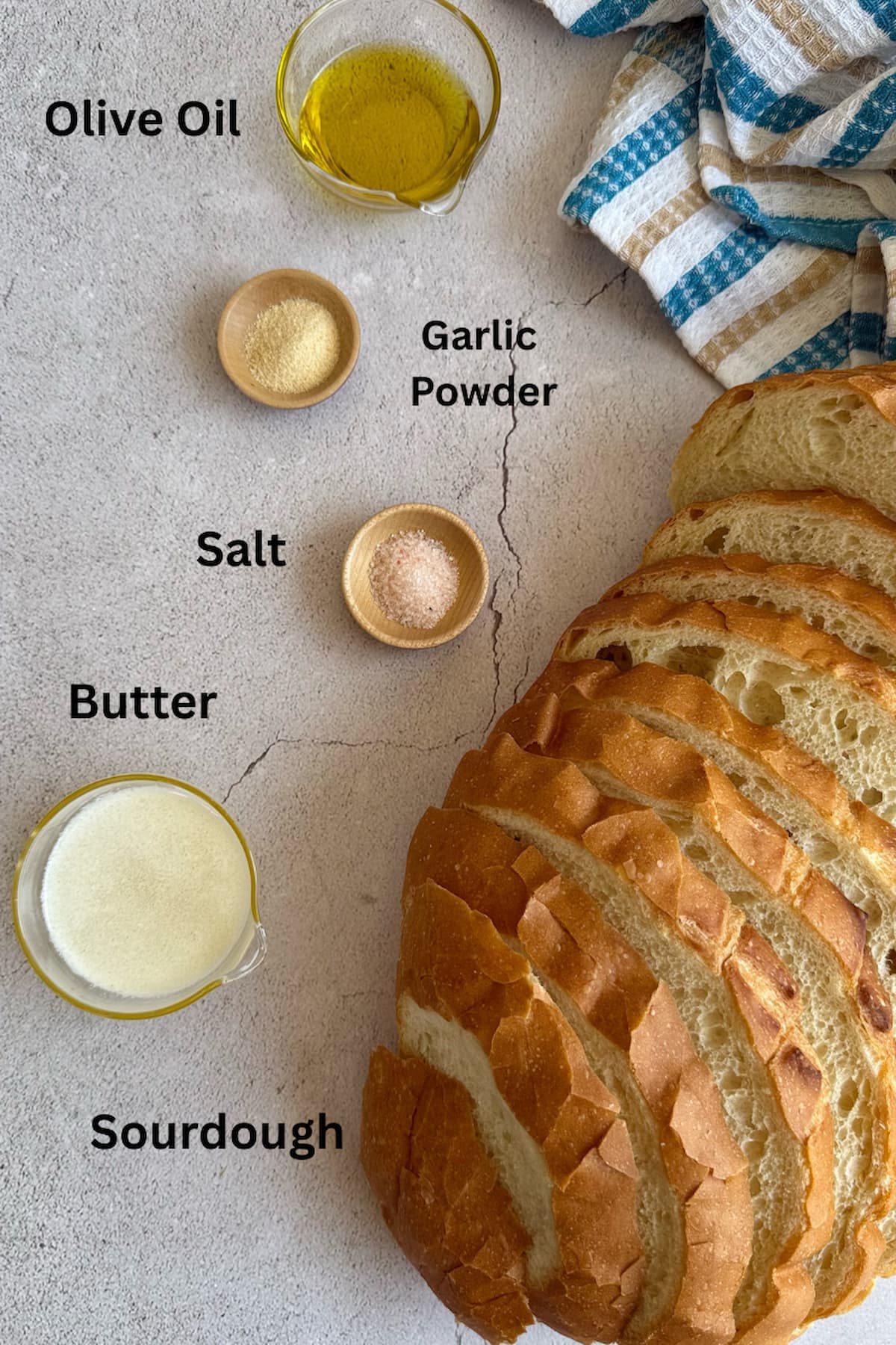 ingredients for sourdough bread croutons - sourdough bread, butter, olive oil, garlic powder, salt