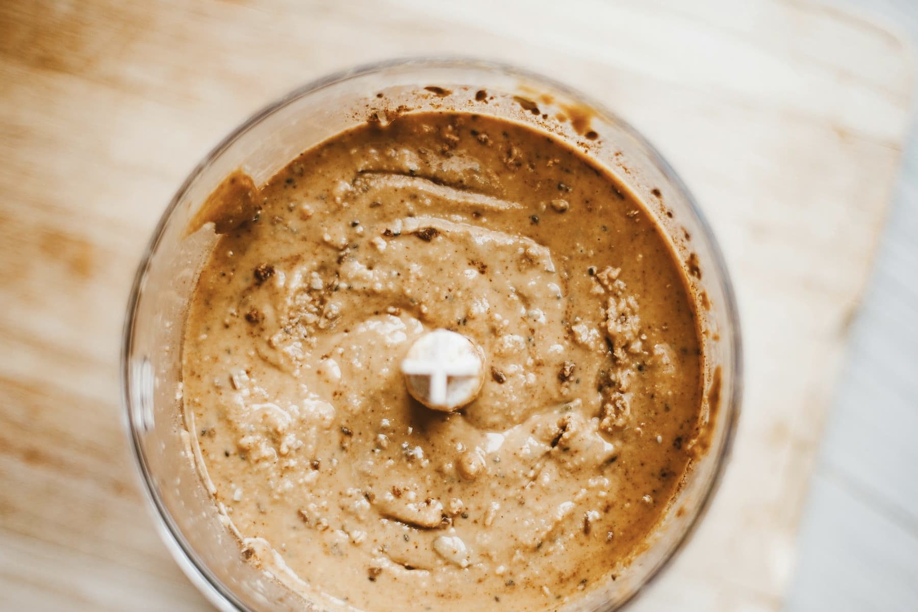 almond butter in the base of a food processor