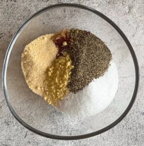 piles of different spices unmixed in a bowl