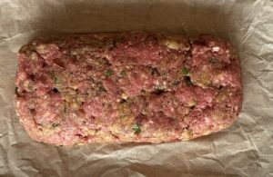 raw meatloaf on parchment