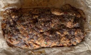 cooked whole meatloaf on parchment