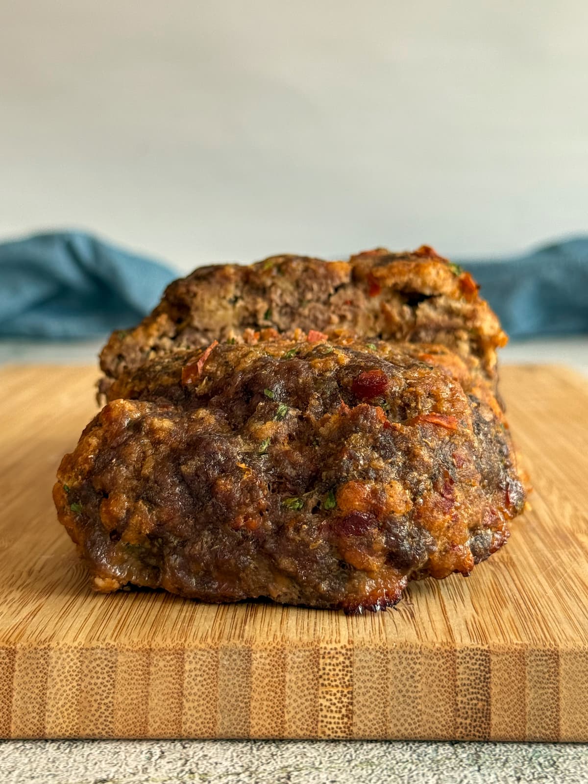 cooked meatloaf on a cutting board