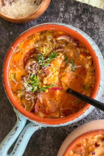 bowl of cottage cheese pizza with toppings, parmesan, and fresh basil
