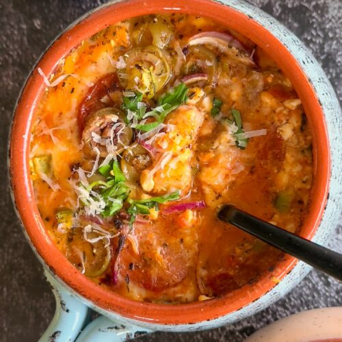 bowl of cottage cheese pizza with toppings, parmesan, and fresh basil