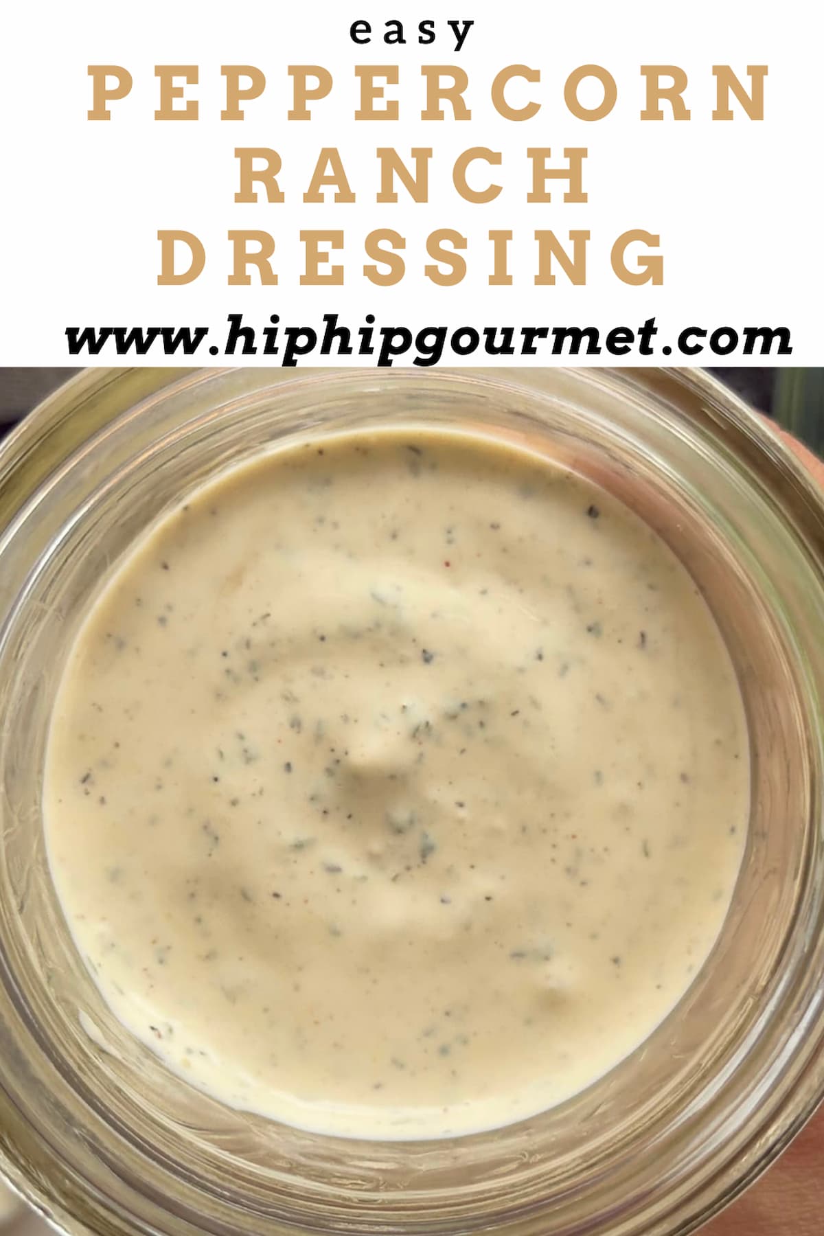 close up of peppercorn ranch sauce in a jar.