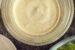 peppercorn ranch dressing in a jar next to a bowl of chopped romaine lettuce.