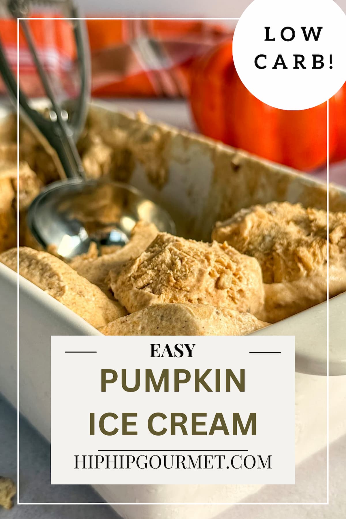 ice cream scoop in a container of pumpkin spice ice cream. pumpkin in the background.