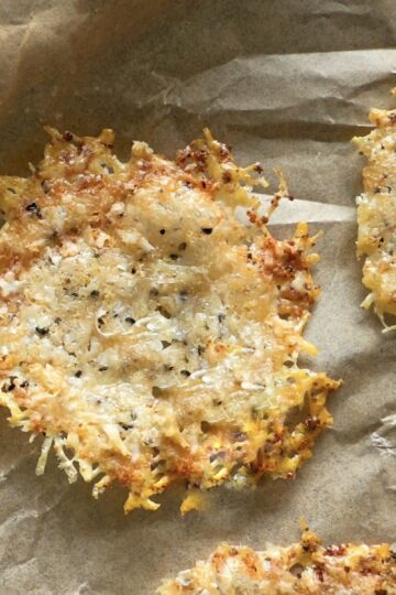 parmesan chips on a parchment lined baking sheet.