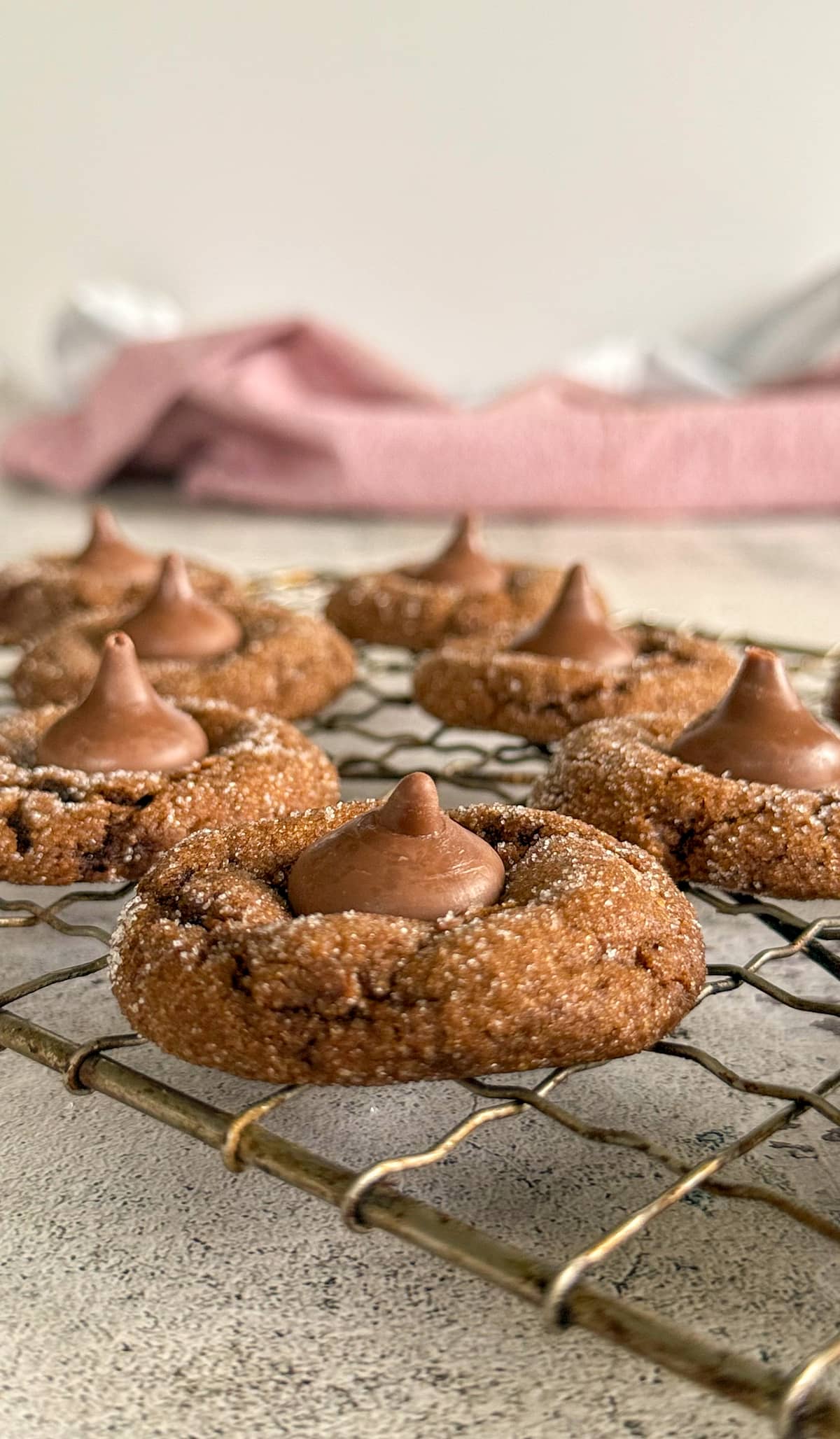 side view of hershey kiss gingerbread cookies on a wire rack.