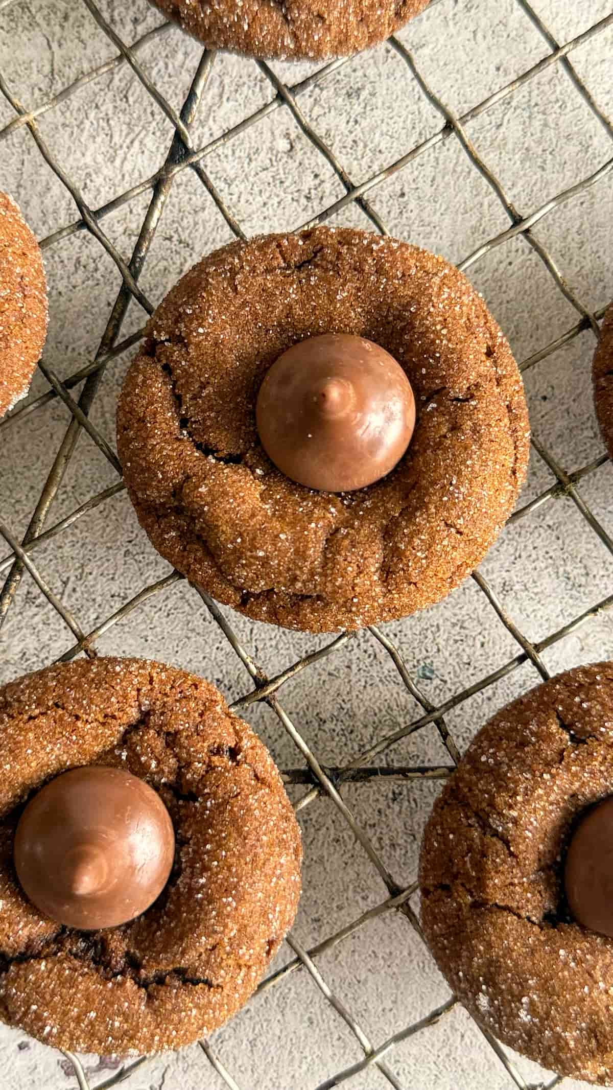 brown hershey kiss cookies on a wire rack.