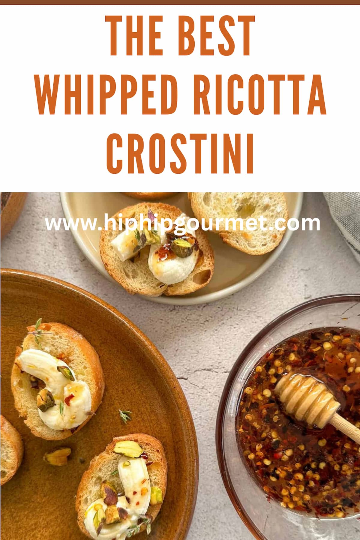 crostini with whipped ricotta, chopped pistachios, and hot honey on a brown plate next to a white plate with a few more crostini. bowl hot hot honey with a honey dipper in frame.