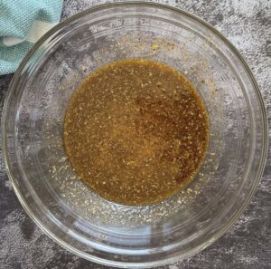 bowl of brown liquid marinade.