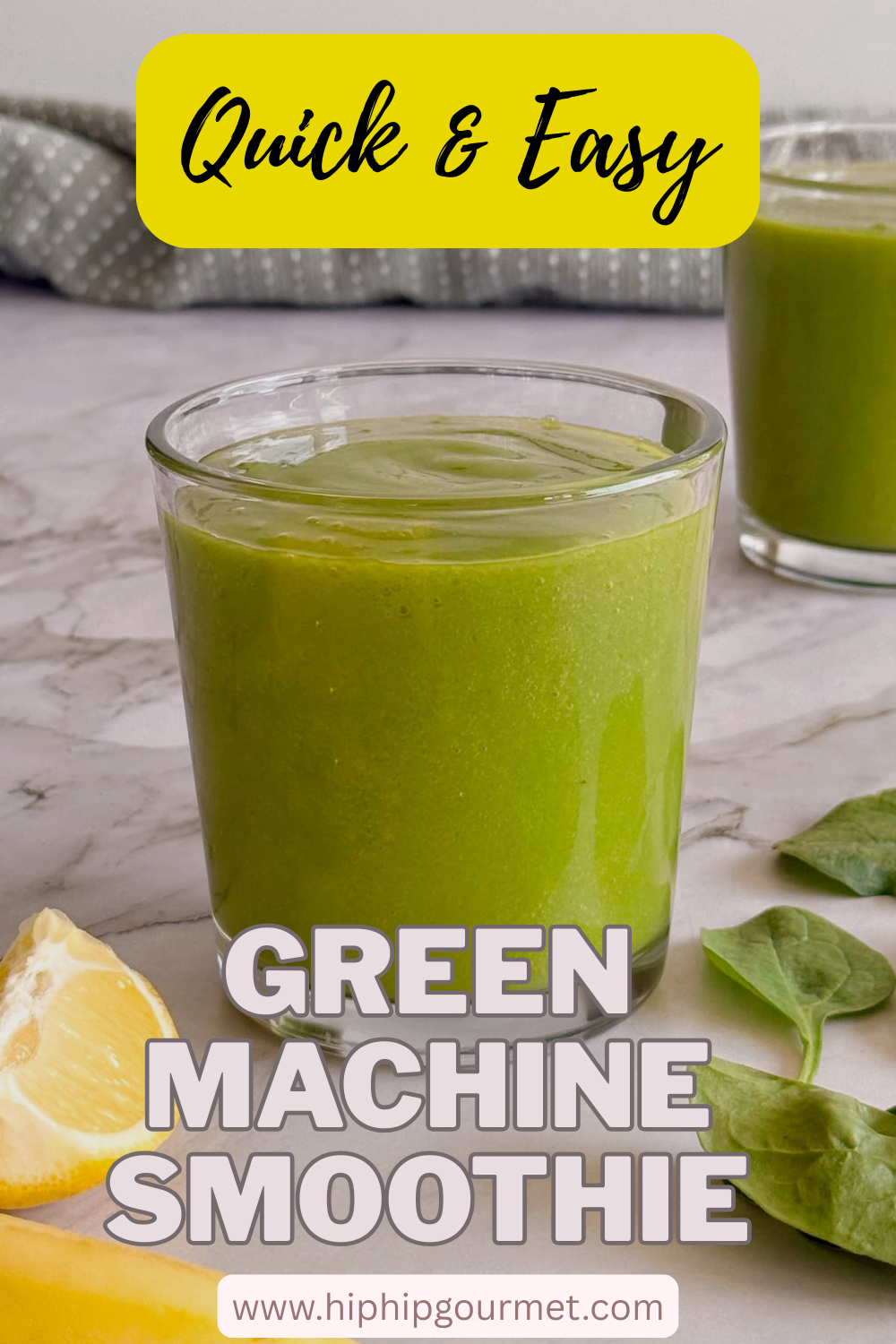 side view of two green smoothies with lemon, banana and spinach leaves in front.