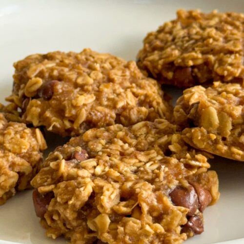 4 ingredient banana oatmeal cookies with chocolate chips on a white plate.