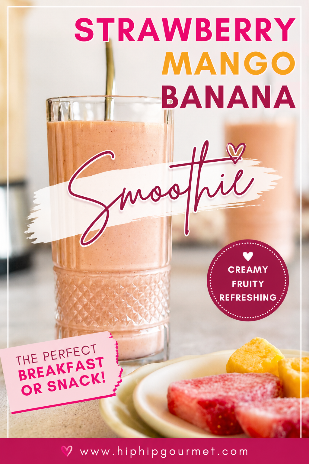 two strawberry mango banana smoothies next to a blender. Plate with frozen strawberry pieces and mango chunks in the front.
