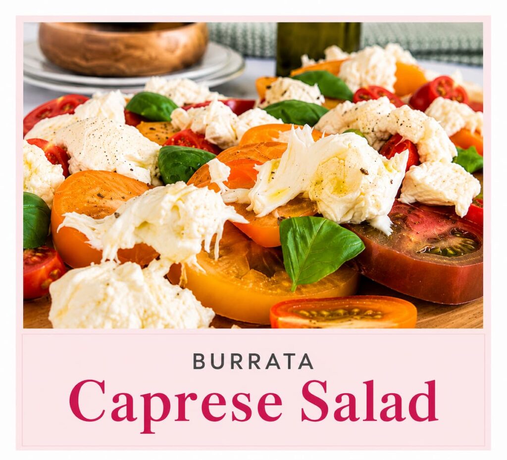 Close up of a burrata caprese salad with creamy burrata, sliced heirloom and cherry tomatoes, fresh basil, olive oil, and cracked black pepper on a wooden board. A soft blush title banner at the bottom reads "Burrata Caprese Salad," creating a clean, editorial-style cover image.