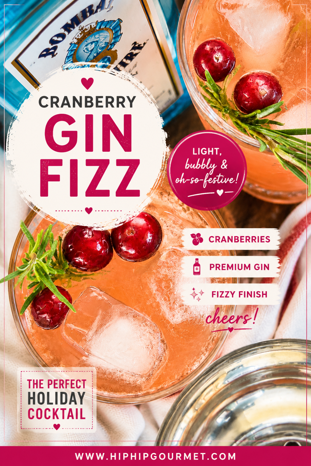 Cranberry gin fizz cocktails garnished with fresh cranberries and rosemary sprigs over ice.