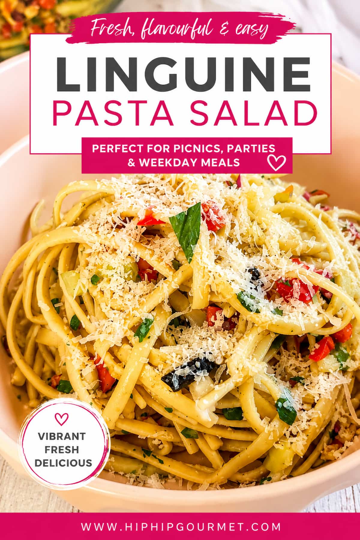Close-up of linguine pasta salad tossed with colourful vegetables, fresh herbs, black olives, and grated cheese in a pink bowl, with text promoting an easy, fresh pasta salad recipe from Hip Hip Gourmet.