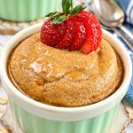 Baked oats without banana topped with creamy peanut butter and fresh strawberries.